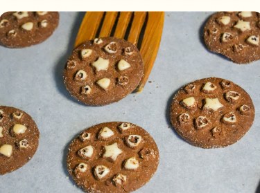 Chocolate cookies topped with white chocolate hearts