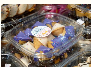 Clear gift box of decorated cookies and fortune cookies