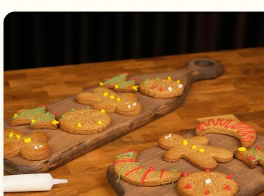 Decorated gingerbread cookies on a wooden board